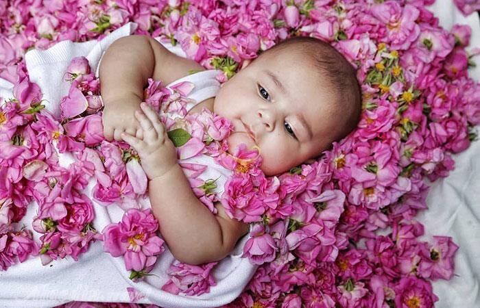 Rolling babies in roses: an ancient ritual bringing blessings to families